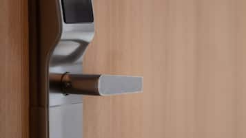 A modern door with a sleek handle and a keyhole.