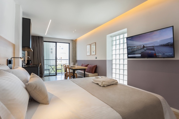 Estudi en suite Deluxe | Roba de llit d'alta qualitat i cobrellits