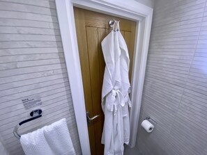 Hair dryer, towels, soap, shampoo