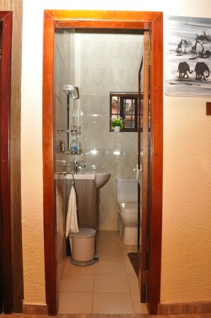 Bathtub, towels, soap, toilet paper