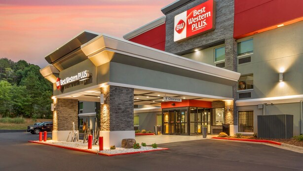 A Best Western PLUS hotel with a modern facade, a 9th-floor entrance, and a well-lit exterior. -  Best Western Plus Cleveland Inn & Suites (Cleveland)