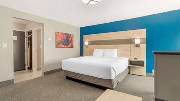 Hypo-allergenic bedding, down duvets, desk, laptop workspace