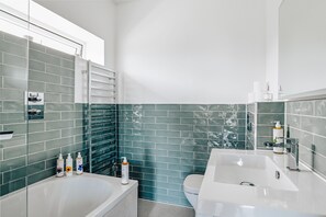 The Lodge Studio | Bathroom | Designer toiletries, hair dryer, heated floors, towels