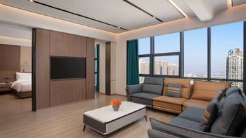 Suite, 1 King Bed, Non Smoking | Minibar, iron/ironing board, free WiFi