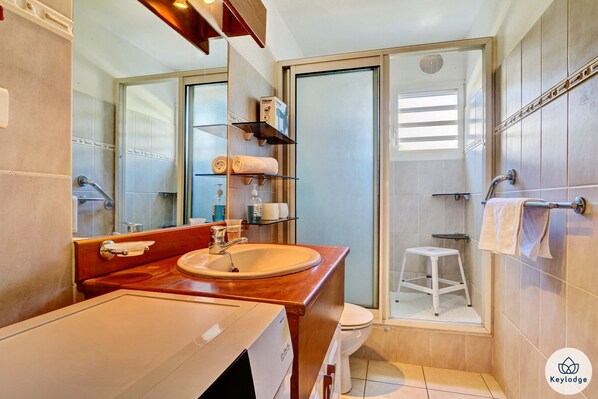 Shower, hair dryer, towels, soap