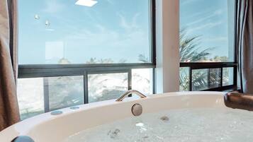 Luxury Room, 1 King Bed, Ocean View | Minibar, desk, laptop workspace, free WiFi