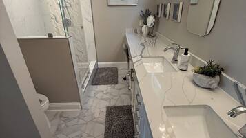 Combined shower/tub, hair dryer, towels, soap