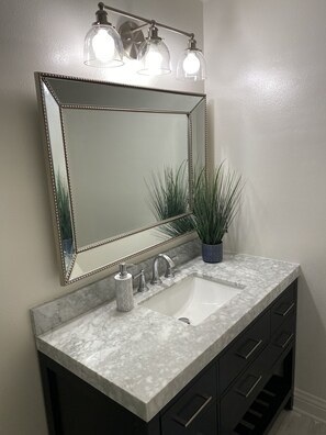 Combined shower/bathtub, hair dryer, towels, soap