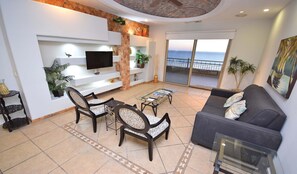Family Condo, 2 Bedrooms, Ocean View, Beachfront | Living area | 32-inch Smart TV with cable channels, TV - RPB Property Management (Puerto Peñasco)