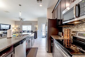 Fridge, microwave, oven, stovetop - Luxurious 5BR Villa in Champions Gate Resort (Davenport)