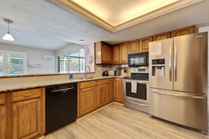 Fridge, microwave, stovetop, dishwasher - Royal Palm on 88th—Private Pool Oasis Near Beach, Hot Tub & Family Fun (Seminole)