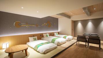 Deluxe Family Room, Non Smoking | Hypo-allergenic bedding, in-room safe, individually decorated, desk