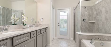 A modern bathroom with a large mirror, two sinks, a shower, and a bathtub.