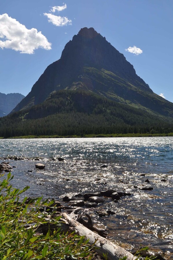 A mountain with a lake in the foreground.