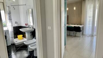 Suite Deluxe | Coin séjour | TV connectée, Netflix, films à la carte, services de streaming