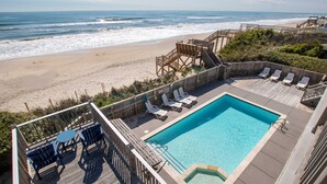 A pool area with a view of the beach and ocean. - OCEANFRONT, 10 BRS, ELEV, Pool, Rec Rm, Theater Rm, OH1251, Beach Plaza (Corolla)