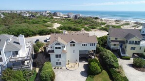 A coastal residential area with houses, a beach, and ocean views. - Semi-Oceanfront, Close to Beach Access, Private Pool, Hot Tub, 109, Happy Ours (Corolla)