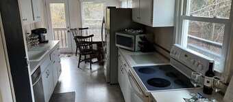 Cozy Cottage with access to and partially obstructed views of the bay.