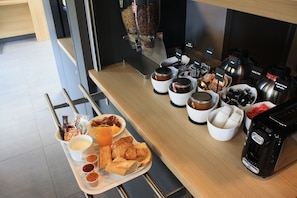 A breakfast buffet with various food items and condiments. - B&B Hotel Marseille Estaque (Marseille)