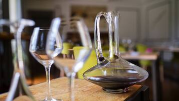 A dining table with clear glassware and a pitcher.