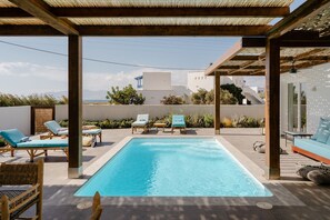 Seasonal outdoor pool, pool loungers