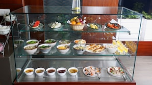 A buffet with various food items and beverages. - Alivaa Hotel, Millennium City Center, Sector 29, Gurugram (Gurugram)