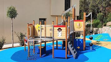 Explore the outdoor play area with a climbing structure and slide.