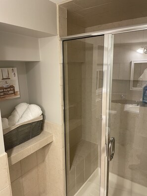 Combined shower/tub, hair dryer, towels, soap