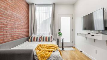 2 bedrooms, desk, blackout curtains, iron/ironing board