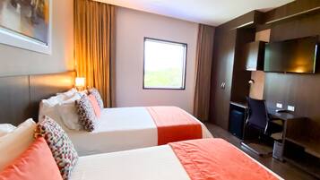 Premium Twin | Premium bedding, down comforters, pillowtop beds, in-room safe