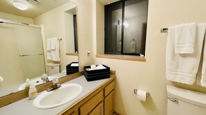 Combined shower/bathtub, hair dryer, towels, soap