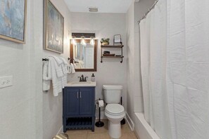 Bathtub, hair dryer, towels