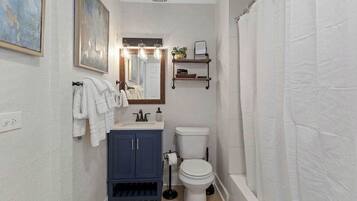 Bathtub, hair dryer, towels