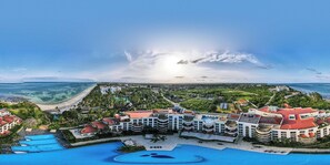 A resort with multiple buildings, a large swimming pool, and a beach view. - Kilua Residences by Cityblue (Mombasa)