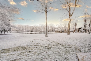 A snow-covered landscape with trees and a pond. - Cozy, Lake View Condo in Hidden Valley with Ski Slope Access (Hidden Valley)