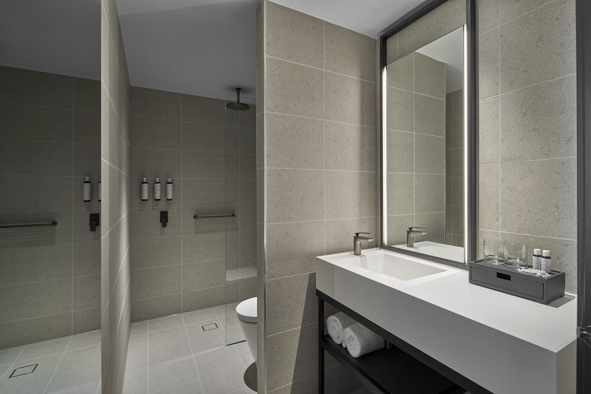 premium bedding, laptop workspace, iron/ironing board