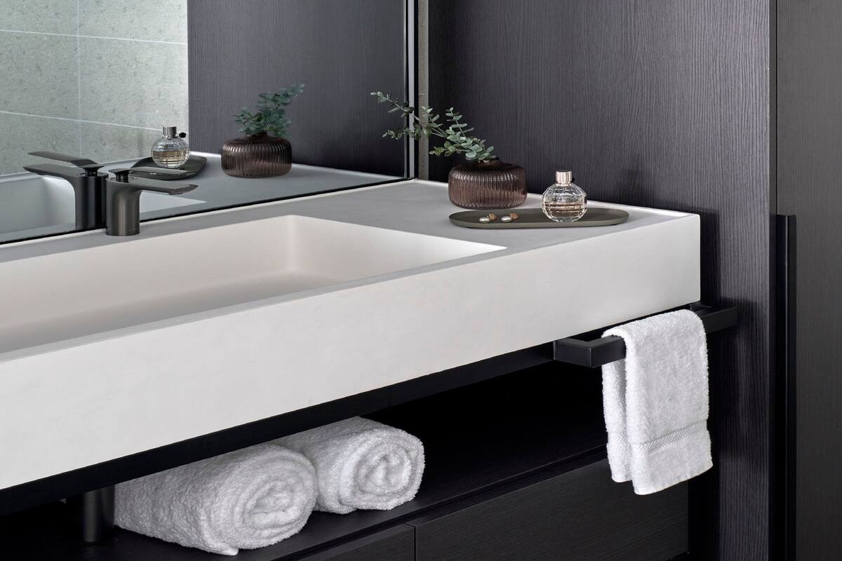 premium bedding, laptop workspace, iron/ironing board