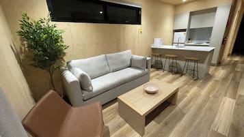 Cabaña Deluxe, 1 habitación | Zona de estar