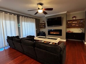 Smart TV, fireplace, books, music library