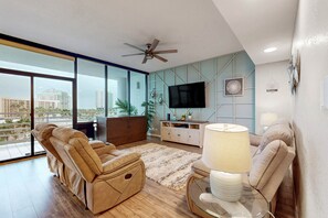 Flat-screen TV, DVD player, books