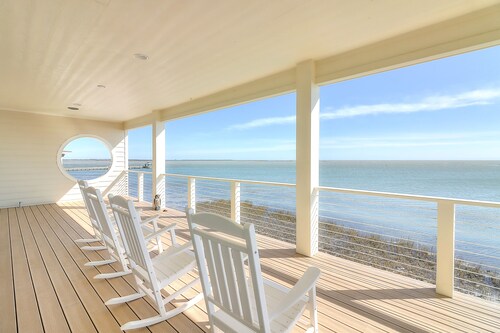 Waterfront infinity pool paradise with stunning sunset views at The Reserve