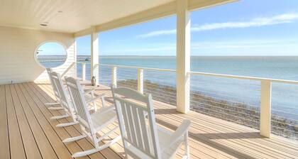 Waterfront infinity pool paradise with stunning sunset views at The Reserve