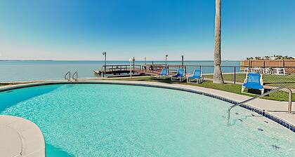 Bay-view all-suite condo with pool & fishing dock - walk to beach