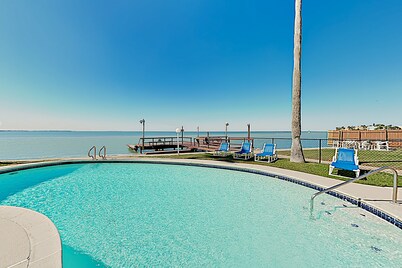 Bay-view all-suite condo with pool & fishing dock - walk to beach