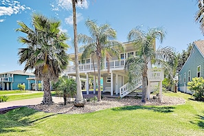 Enjoy a home away from home in this charming two-story residence with a balcony and beautifully manicured lawn.