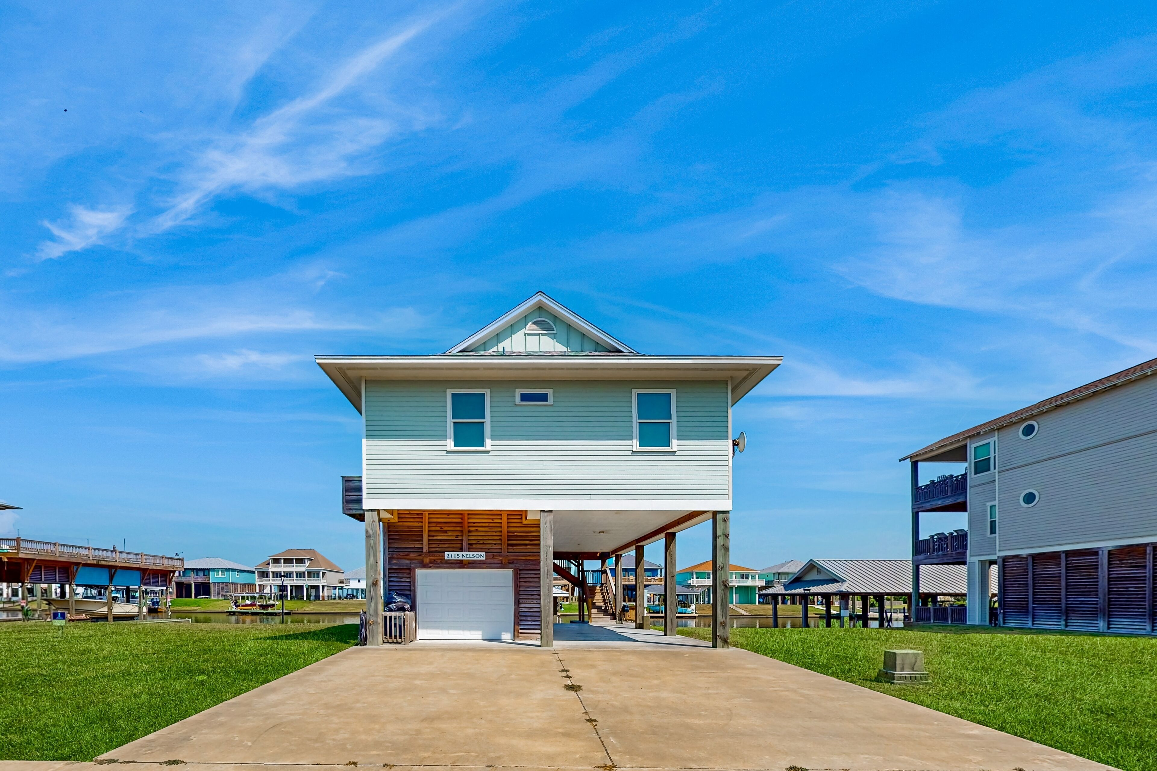 Brand-New Waterfront Home w/ 2nd-Story Deck in Upscale Community – On Canal
