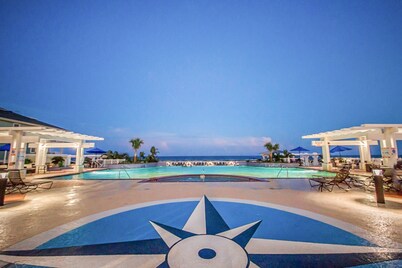 Gulf-front condo at Pointe West with 2 pools, spas & beach access