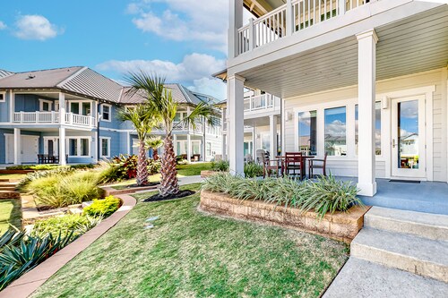 Bright waterfront villa with pool, boat slip, patio & balcony in gated community