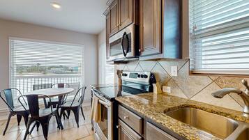 Coffee/tea maker, fridge, microwave, oven