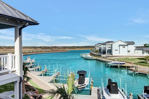Sophisticated canal-view villa with pool, vast fishing pier, deck & washer/dryer
